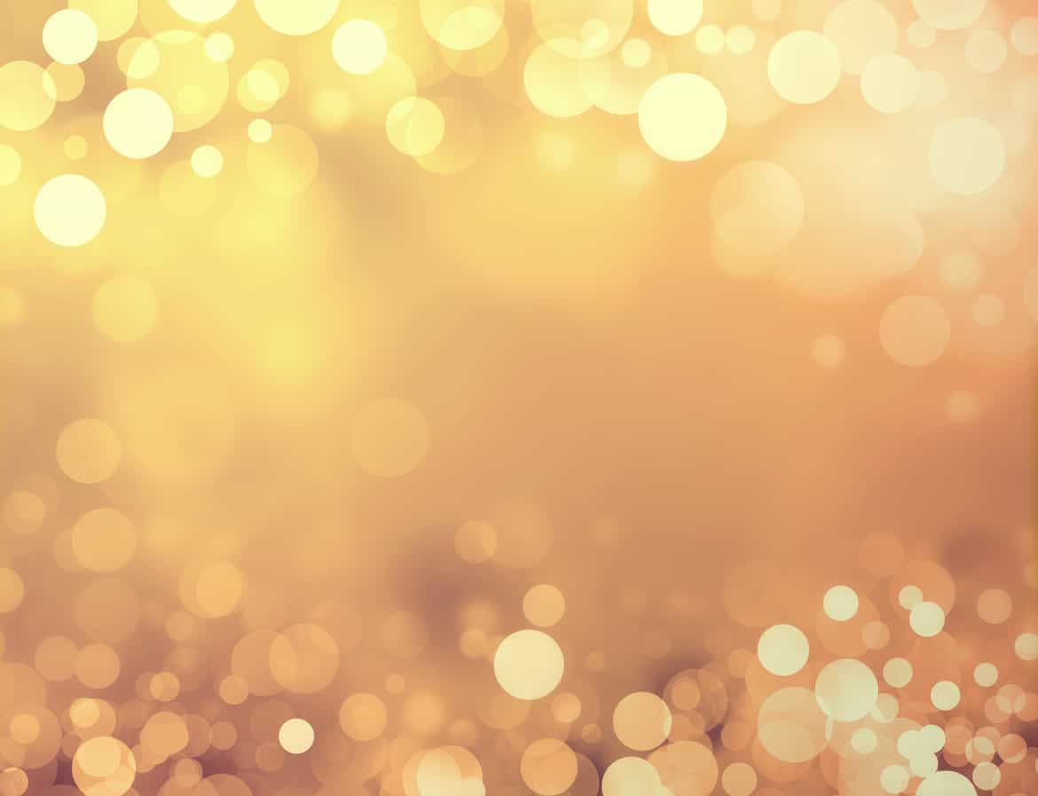 Shiny gold background with blurry circles and sparkles
